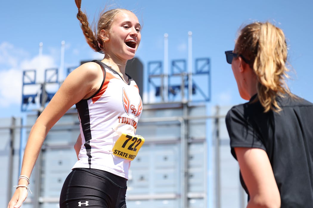 Grand Rapids' Ginger Pogorelc celebrates clearing 5-5 in the Class 2A girls high jump.