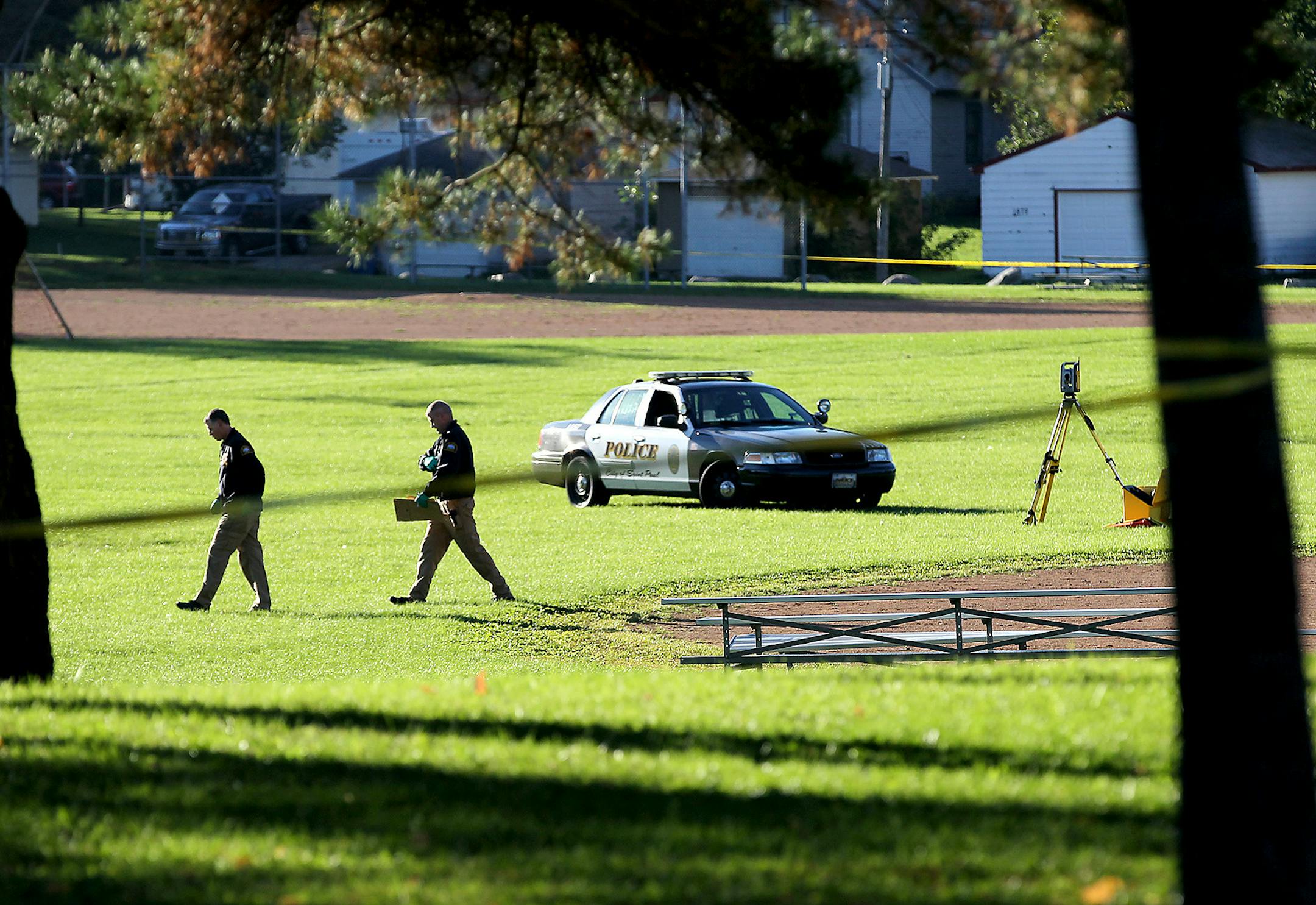 Police investigate the scene where a body was discovered near the Hazel Park Recreation Center, Tuesday, September 29, 2015 in St. Paul