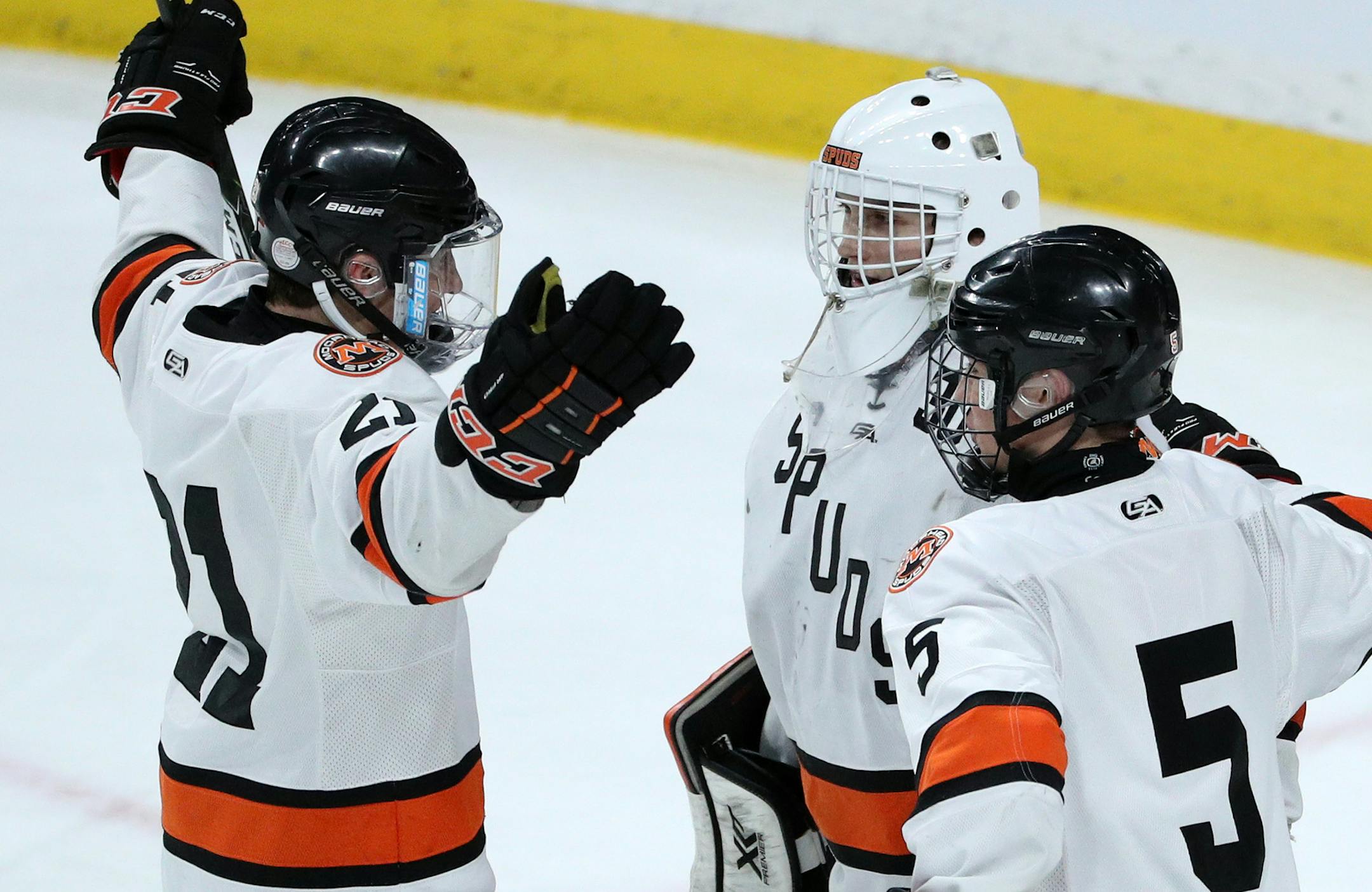 Morhead's Jack Stetz (21) and Ethan Frisch (5) celebrate the win with goaltender Lance Leonard (30) Thursday. ] ANTHONY SOUFFLE ï anthony.souffle@startribune.com Players competed during the boys' hockey state tournament Class 2A quarterfinals Thursday, March 9, 2017 at the Xcel Energy Center in St. Paul, Minn.