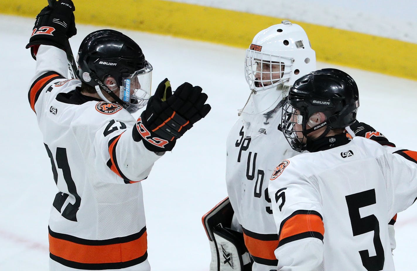 Morhead's Jack Stetz (21) and Ethan Frisch (5) celebrate the win with goaltender Lance Leonard (30) Thursday. ] ANTHONY SOUFFLE &#xef; anthony.souffle@startribune.com Players competed during the boys' hockey state tournament Class 2A quarterfinals Thursday, March 9, 2017 at the Xcel Energy Center in St. Paul, Minn.