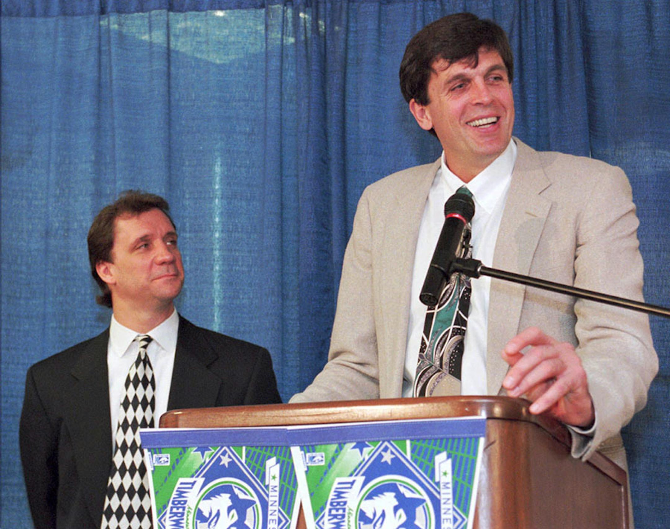 Kevin McHale, who starred at the University of Minnesota before a 13-year career with the Boston Celtics, answers a reporter's question during a news conference in Minneapolis, Thursday, May 11, 1995, to announce that he has become the vice president ofbasketball operations for the Minnesota Timberwolves. At left, is Phil Saunders, who has been named the Timberwolves general manager.