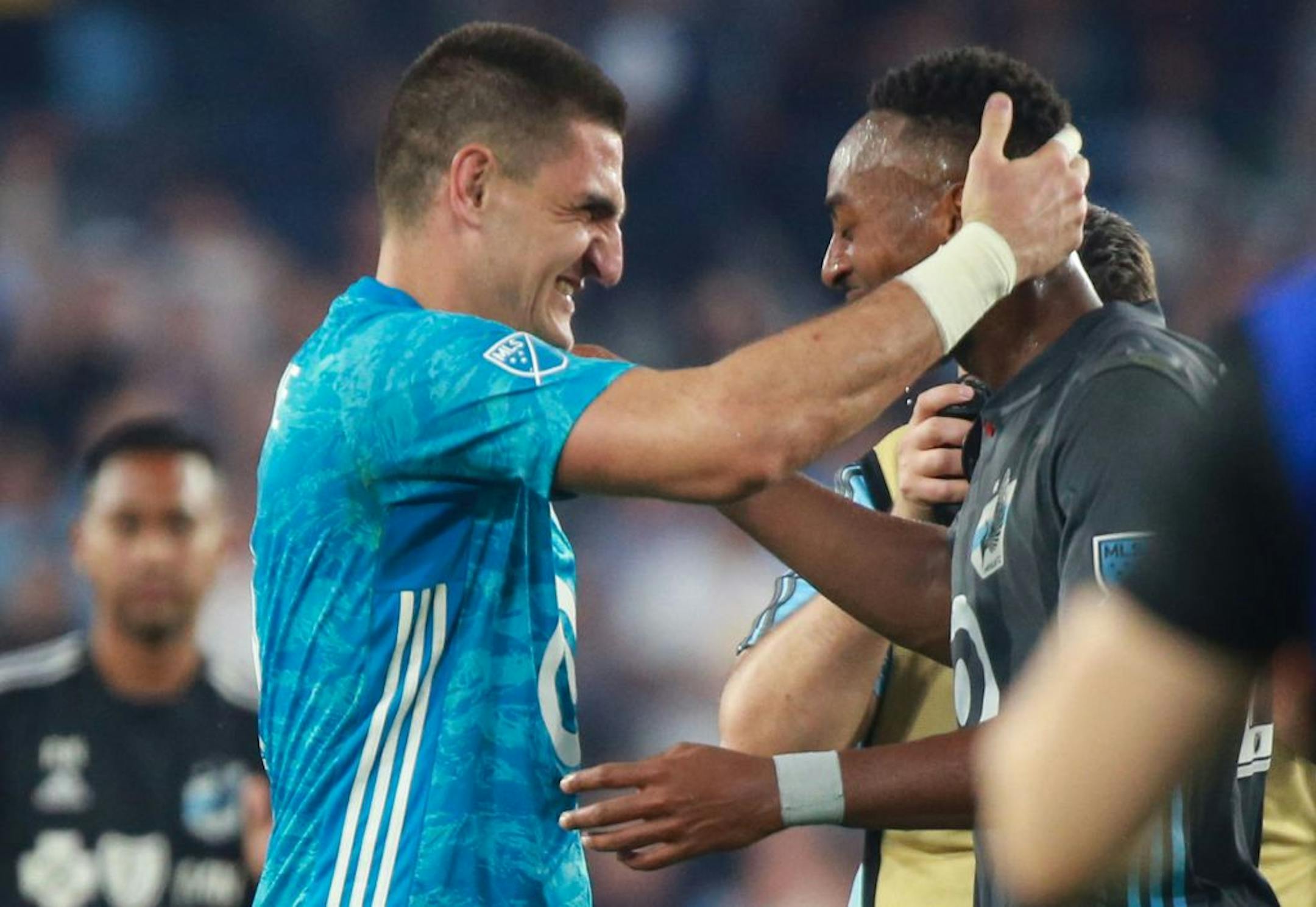 Vito Mannone (1) and Mason Toye (23), the two stars of the game in stoppage time embrace one another post game. ALEX KORMANN ¥ alex.kormann@startribune.com The Minnesota United FC took on FC Dalls on Saturday July 13, 2019 at Allianz Field in St. Paul, MN.