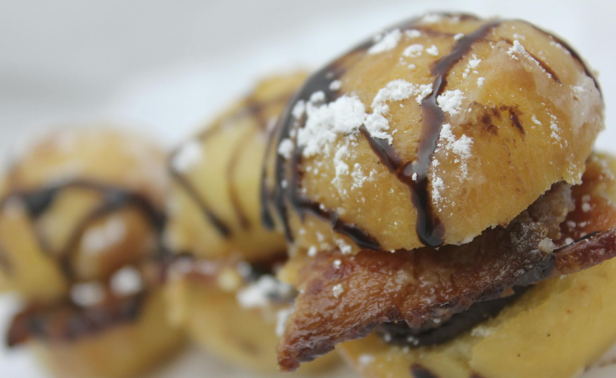 The candied bacon donut sliders are sliced glazed donut holes with thick candied bacon and a chocolate red wine ganache at Minnesota Wine Country. Photo provided by Minnesota State Fair
