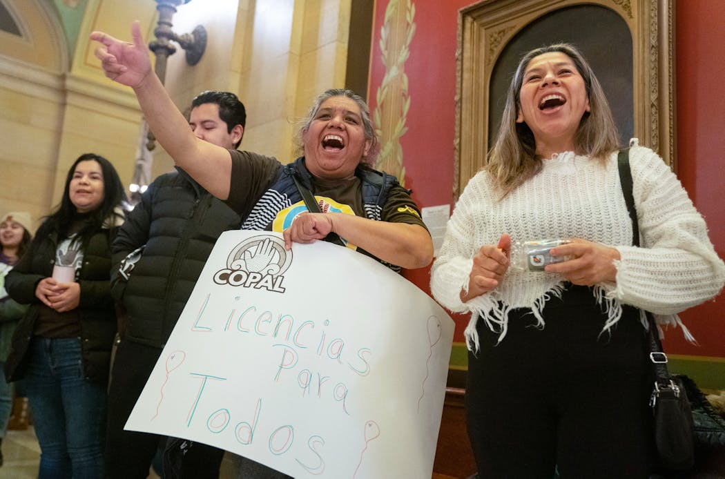 Esperanza Dominguez and Elida Delarosa, left to right, chanted their support for the “Driver’s Licenses for All” bill on Feb. 21 at the Minnesota State Capitol.