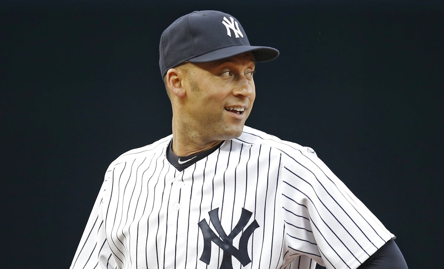 New York Yankees shortstop Derek Jeter looks over his shoulder while waiting for the start of a baseball game against the Oakland Athletics at Yankee Stadium in New York, Wednesday, June 4, 2014. (AP Photo/Kathy Willens) ORG XMIT: OTKKW129