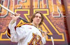 Minnesota men's hockey freshman forward Logan Cooley poses for a portrait Thursday, March 30, 2023 outside 3M Arena at Mariucci. ]