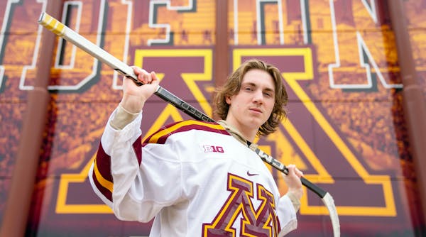 Minnesota men's hockey freshman forward Logan Cooley poses for a portrait Thursday, March 30, 2023 outside 3M Arena at Mariucci. ]