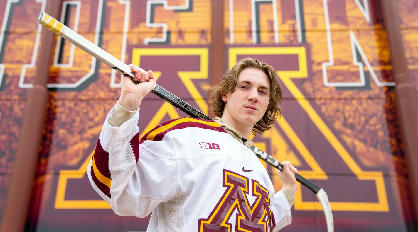 Minnesota men's hockey freshman forward Logan Cooley poses for a portrait Thursday, March 30, 2023 outside 3M Arena at Mariucci. ]