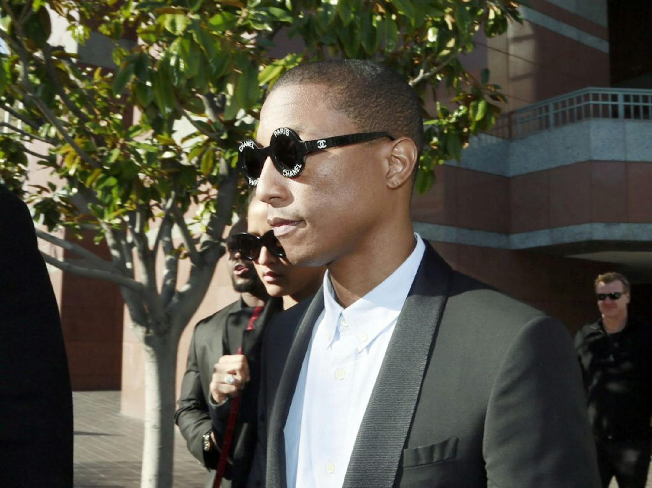 Pharrell Williams leaves Los Angeles Federal Court after testifying at trial in Los Angeles, Wednesday, March 4, 2015. The Grammy-winning singer Williams says he wasn't trying to copy the late Marvin Gaye's music for the hit song "Blurred Lines," but he was trying to evoke the feeling of late 1970s tunes. Williams is being sued by Gaye's children, who claim "Blurred Lines" improperly copies their father's hit "Got to Give it Up." Singer Robin Thicke and rapper T.I. are also defendants in the cas