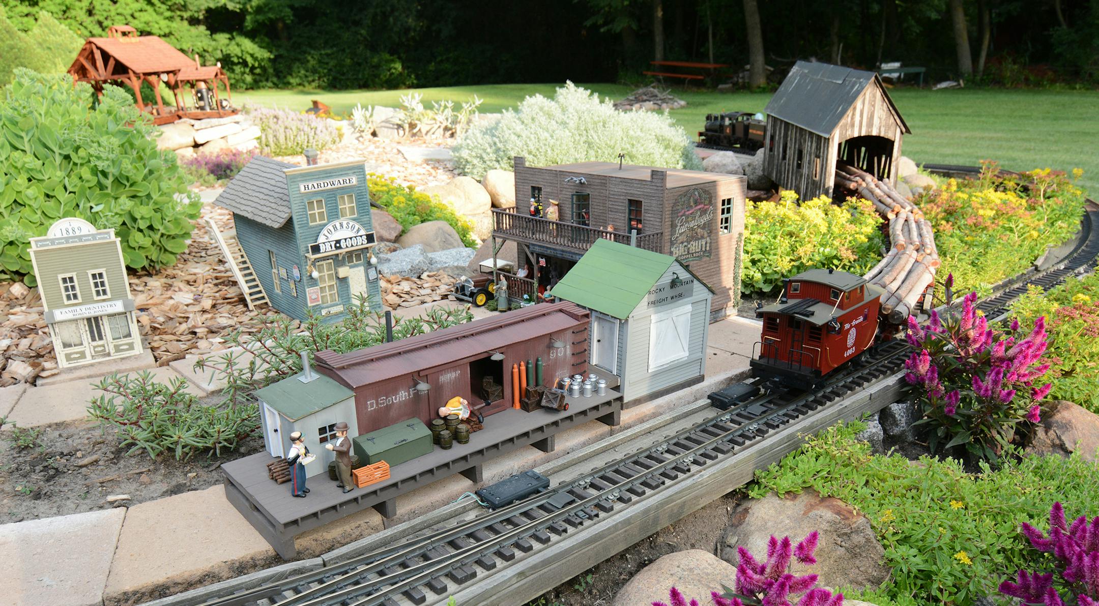Jim Shaver has built many of his garden railway structures from scratch &#x2014; including a grain mill, covered and trestle bridges, and a sawmill.