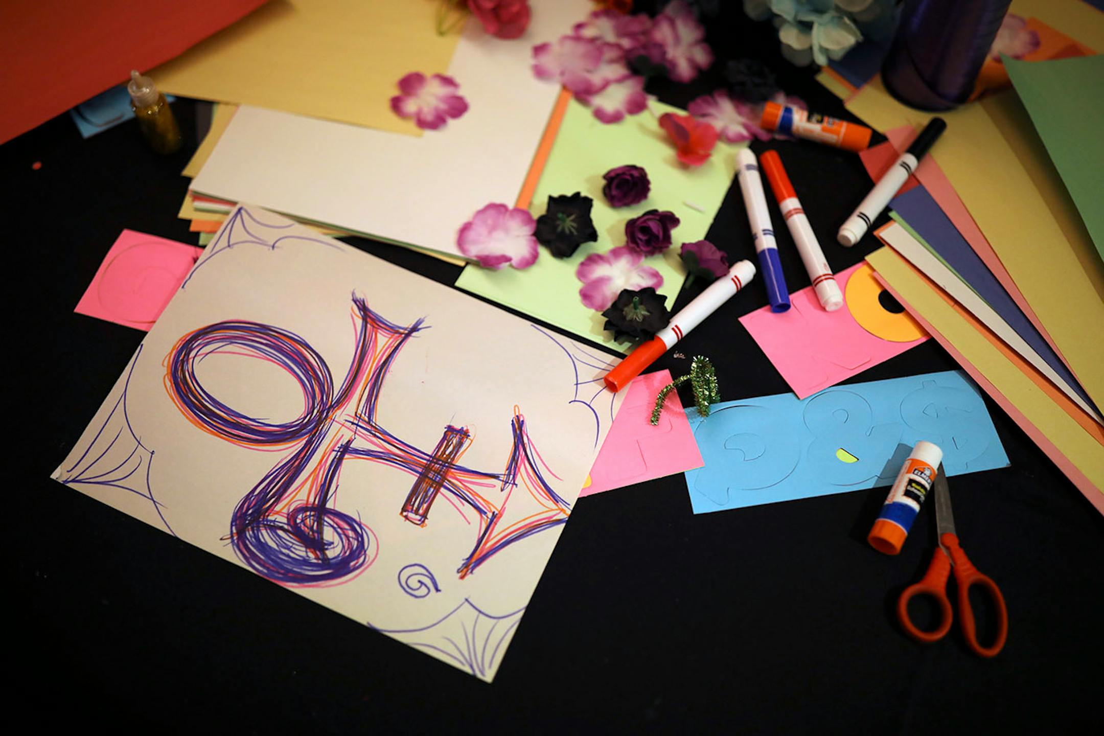People could visit a crafting station and create their own tribute to Prince to place on a chain link fence memorial at the Guthrie.