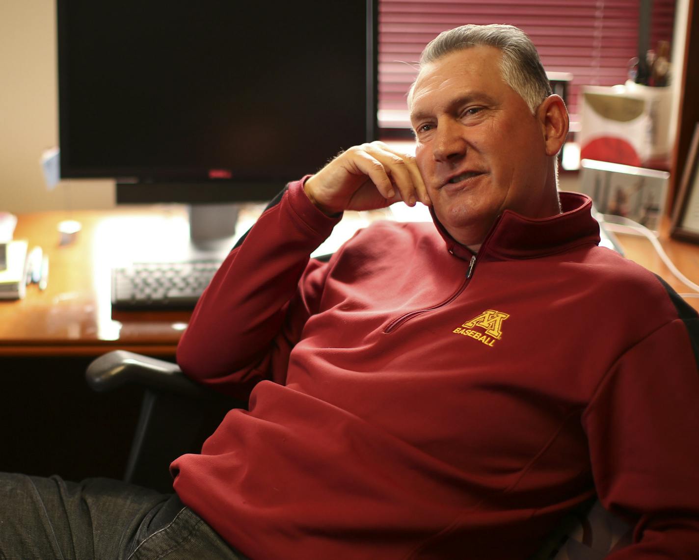 U of M head baseball coach John Anderson talked with a couple of reporters in his office Monday afternoon. ] JEFF WHEELER &#xef; jeff.wheeler@startribune.com The Minnesota Gophers baseball team is preparing for their home opener this Wednesday, which now has been postponed until Friday. After removing snow from the field over the weekend, on Monday, March 24, 2014, a crew turned to clearing snow from the stands. Head coach John Anderson also talked about the upcoming season and the challenges of