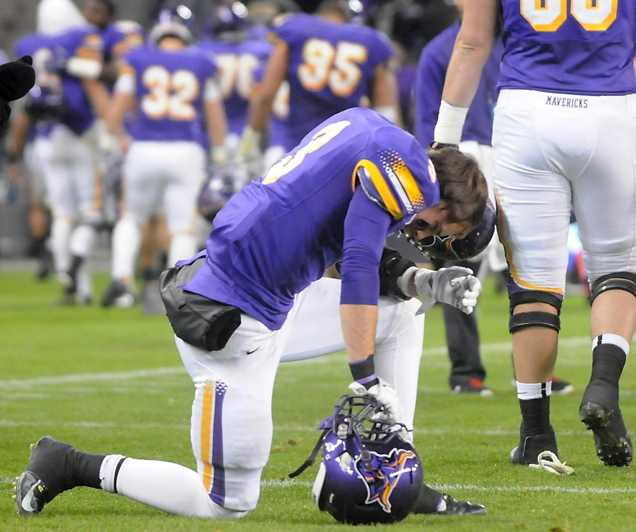 Minnesota State's Patrick Schmidt (3) pauses on the field as his teammates head for the locker room after the Mavericks' loss to Colorado State University-Pueblo in the NCAA Division II national championship game Saturday at Sporting Park in Kansas City. Photo by Pat Christman