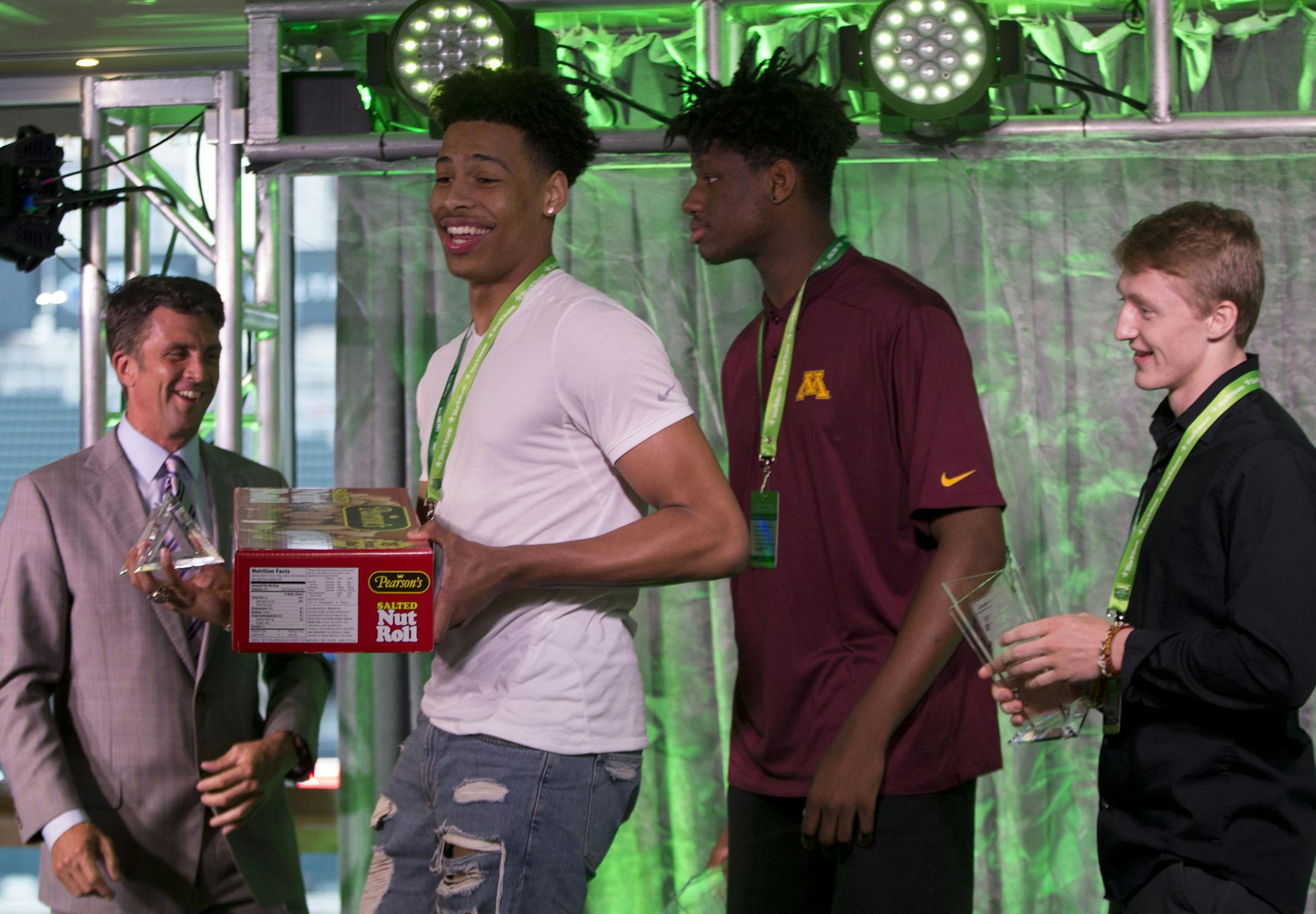 (From left) Sy Chatman, Daniel Oturu and Ryan Larson were recognized for the Sweetest Play of the year award.They were also given a large box of candy as a bonus prize. ] ALEX KORMANN &#x2022; alex.kormann@startribune.com The first All-Metro Sports Awards were hosted by the Star Tribune at Target field on Tuesday evening. High school athletes from across the area were invited to partake in an evening of festivities and food to celebrate their accomplishments. Awards were handed out for different