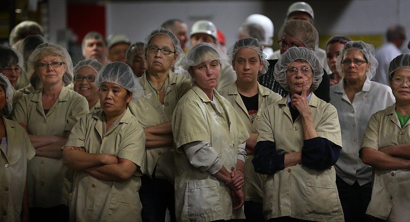 Workers at the Pearson Candy Company waited for a ribbon cutting ceremony to begin to mark the first time that Bit-O-Honey candy has been made at its factory on West Seventh Street in St. Paul. The confection, a brand acquired in 1924, was previously manufactured in Illinois. The move will create at least 40 jobs according the company. ] JIM GEHRZ &#x201a;&#xc4;&#xa2; jgehrz@startribune.com / St. Paul, MN / March 26, 2014 / 11:00 AM / BACKGROUND INFORMATION: Bit-O-Honey candy has been around for