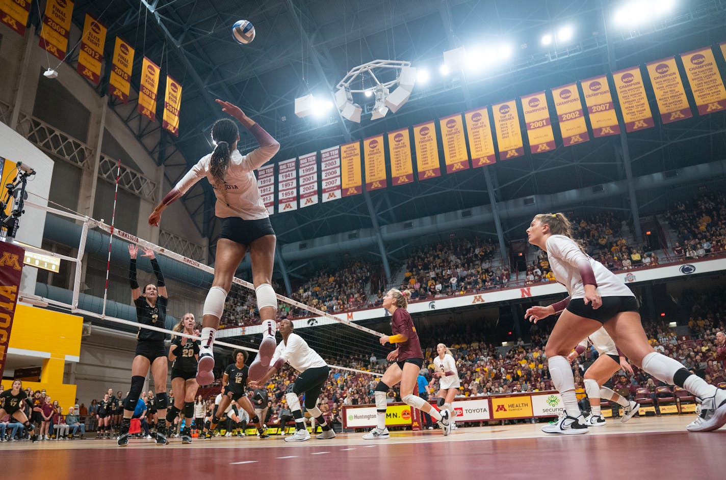 Minnesota outside Taylor Landfair (12) goes up for a spike against Purdue in the first set Saturday, Oct. 22, 2022 at Maturi Pavilion in Minneapolis. ]