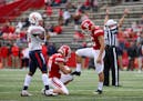 Rutgers holder Cole Murphy pretended to shine the shoes of Scarlet Knights place kicker Justin Davidovicz on Saturday but it's hardly been fin and gam