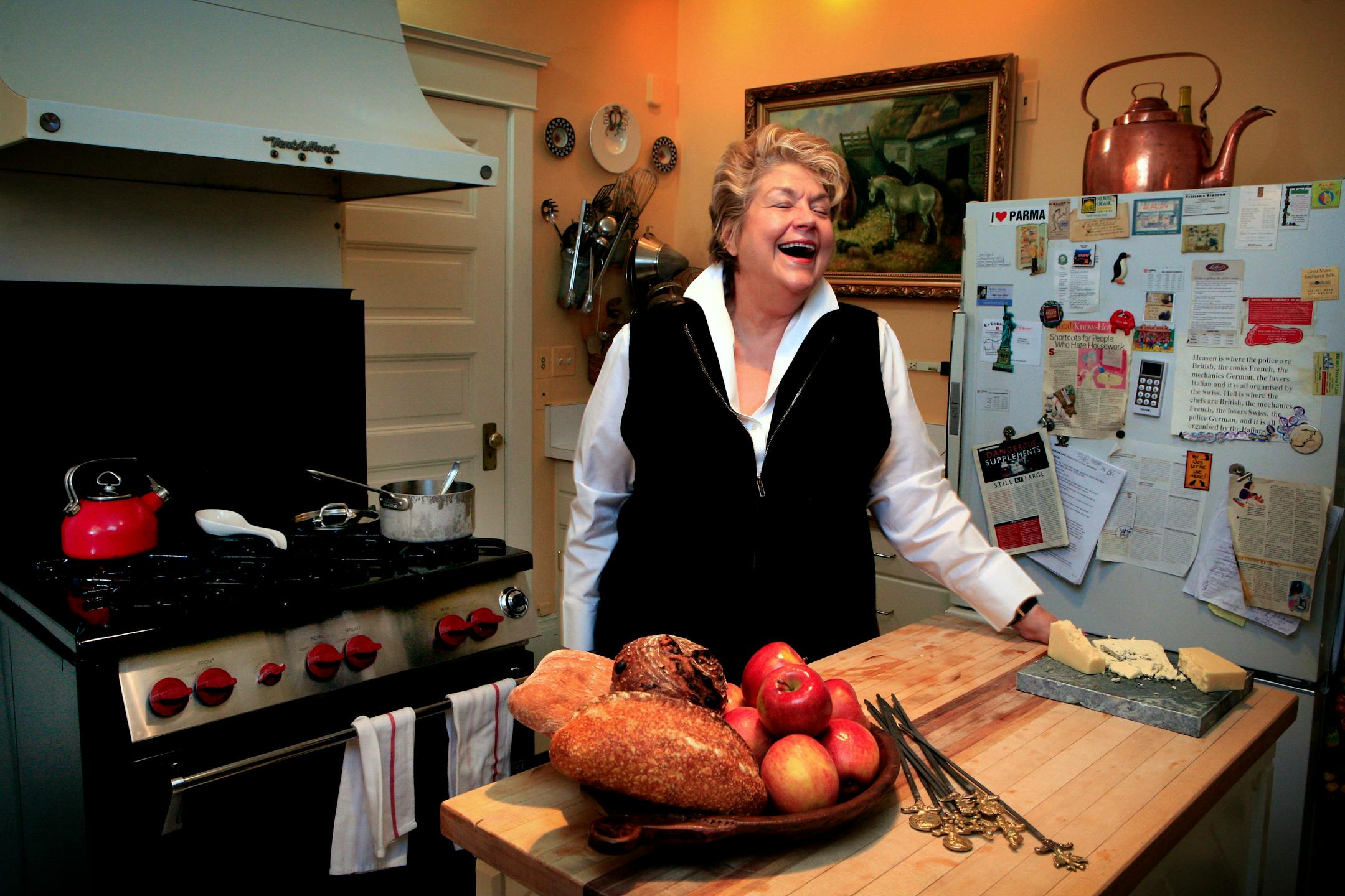 One of Lynne Rossetto Kasper's favorite rooms is her kitchen, which is only fitting for someone who writes cookbooks, has a cooking show on public radio and loves to entertain. The 18,000 BTU Wolf stove behind her was purchased with her first royalty check from her book "The Splendid Table" and she calls it "Babe."