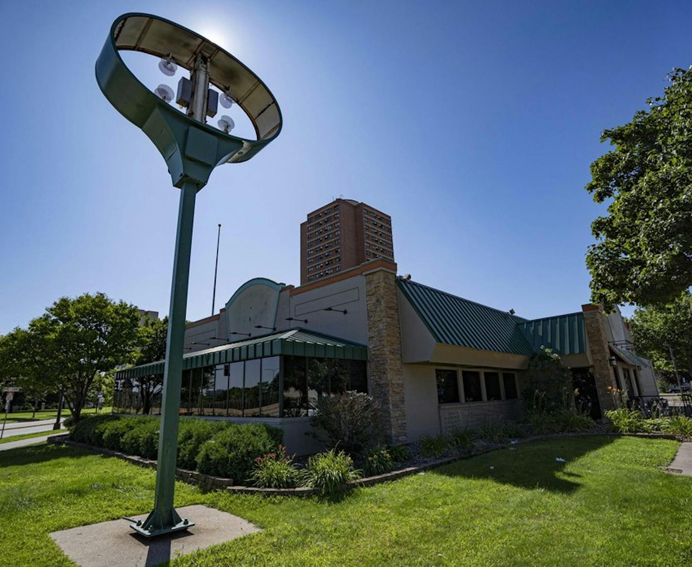 In this Tuesday, July 30, 2019 photo, the logo and sign have been removed from the Perkins restaurant in Minneapolis. The last Perkins in Minneapolis city limits, adjacent to the Cedar-Riverside neighborhood, closed its doors on July 14. Sunday mornings on Riverside Avenue won't be the same with the recent closure of its Perkins Restaurant & Bakery, a long-standing area staple. (Tony Saunders/The Minnesota Daily via AP)