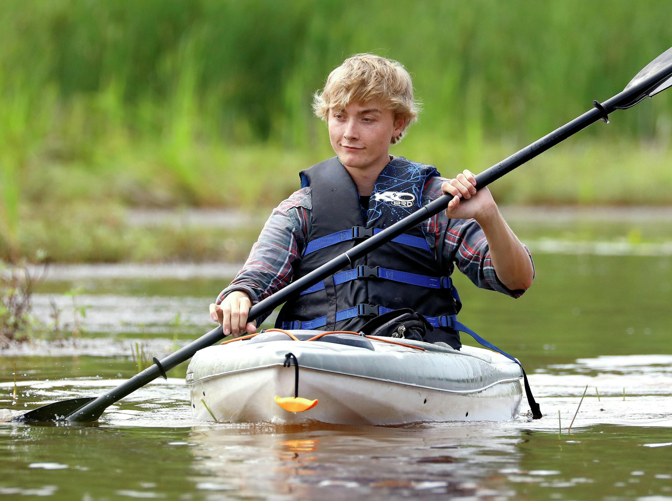 T08.08.2018 -- Steve Kuchera -- 081218.O.DNT.GeesepoliceC1 -- UWS biology student Sam Hanson kayaks near Pokegema Bay on Wednesday. Hanson is trying to determine if people regularly boating near wild rice beds will chase away geese who have been damaging the beds. Steve Kuchera / skuchera@duluthnews.com