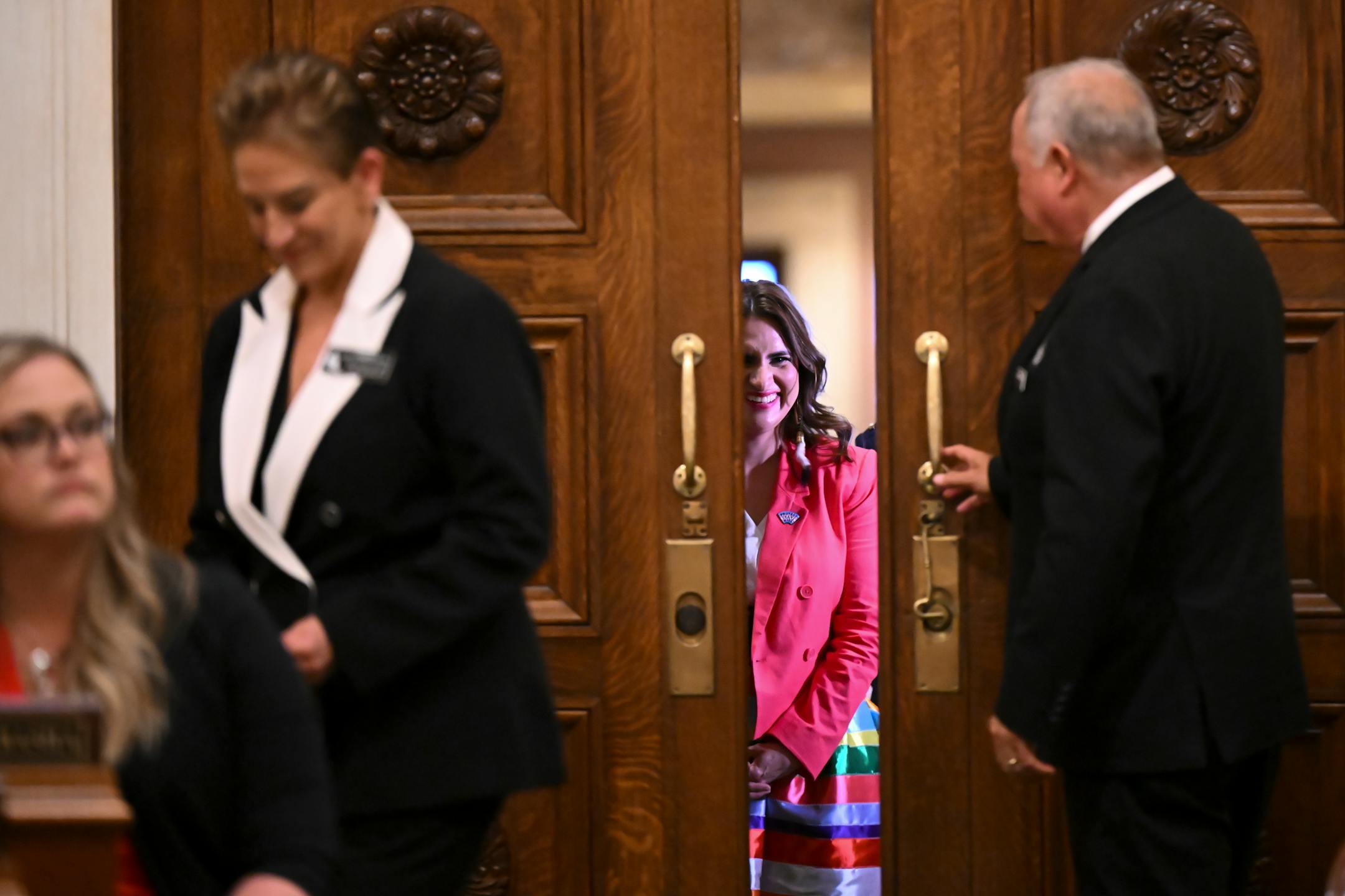 Minnesota Lt. Gov. Peggy Flanagan smiles before the was welcomed into the house chambers for the State of the State address.