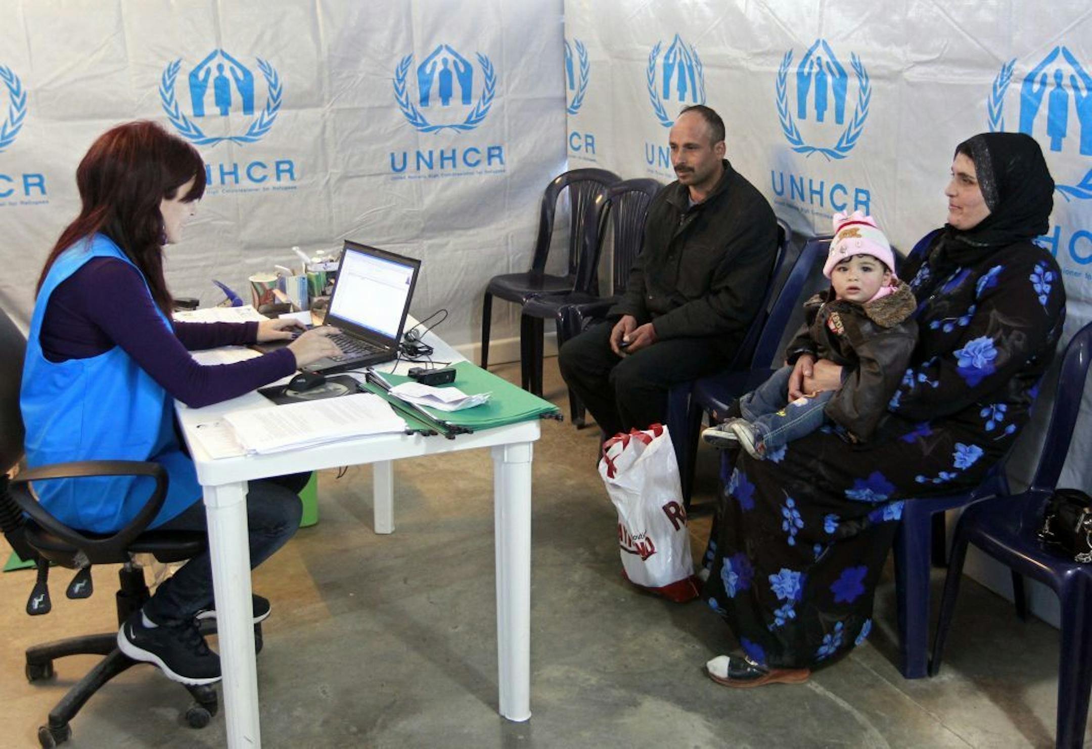 A Syrian family who fled their home from Aleppo register, at the UNHCR center in the northern city of Tripoli, Lebanon, Wednesday, March. 6, 2013. The number of Syrians who have fled their war-ravaged country and are seeking assistance has now topped the one million mark, the United Nations� refugee agency said Wednesday warning that Syria is heading towards a "full-scale disaster."