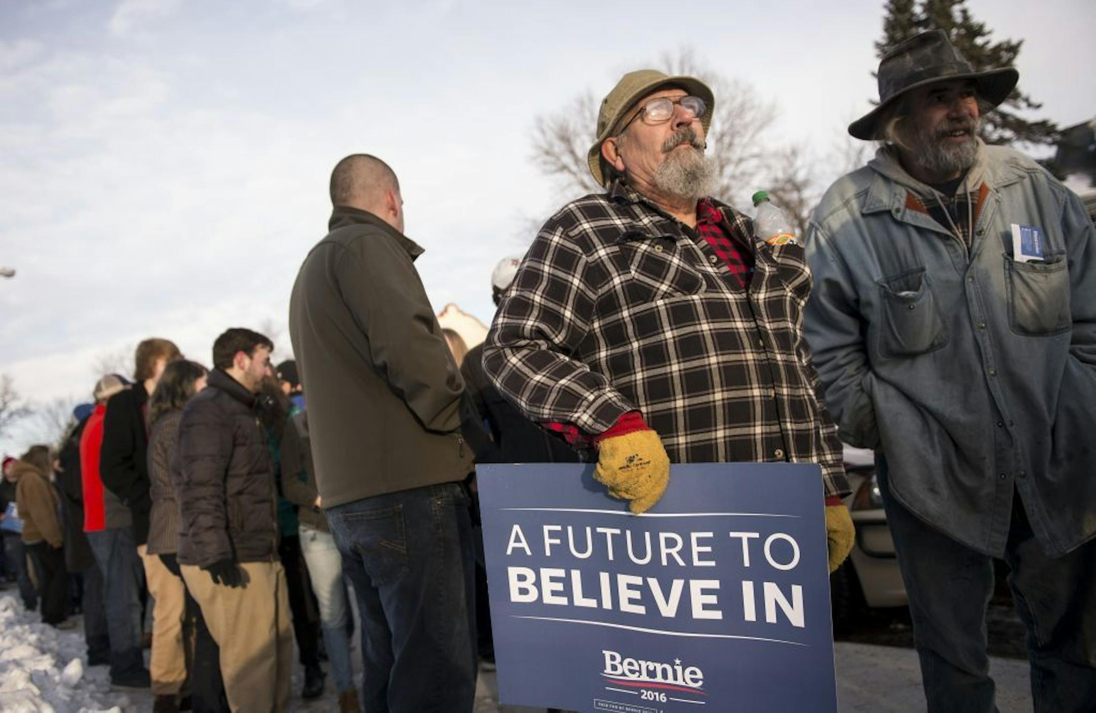 Bill Hamm, of Bovey, right of center, waited to hear Bernie Sanders speak at Hibbing High School Friday morning.