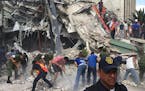 People search for survivors in a collapsed building in the Roma neighborhood of Mexico City, Tuesday, Sept. 19, 2017. A powerful earthquake has jolted