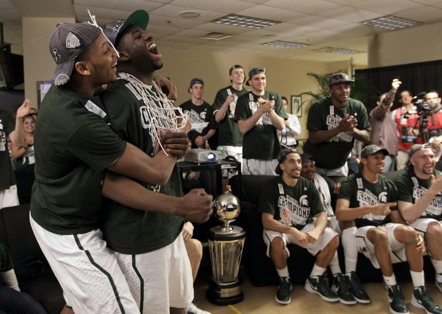 Michigan State center Adreian Payne, left, and forward Draymond Green react as the team is announced as the No. 1 seed in the West region in the NCAA men's basketball tournament, in Indianapolis on Sunday, March 11, 2012. Earlier Sunday, Michigan State beat Ohio St 68-64 in the final of the Big Ten tournament.