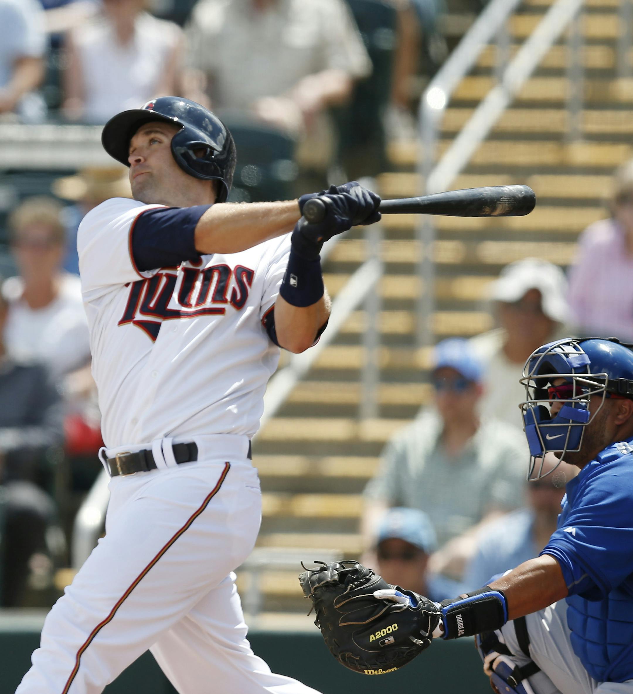 Minnesota Twins' Brian Dozier (2) hits a solo home run in the first inning against Toronto Blue Jays relief pitcher Todd Redmond during an exhibition spring training baseball game, Tuesday, March 24, 2015, in Fort Myers, Fla. (AP Photo/Brynn Anderson)