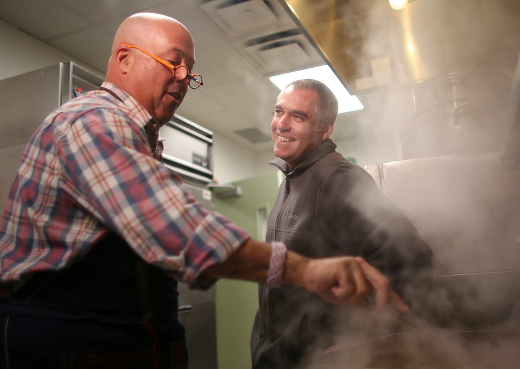 Travel Channel host (and Twin Cities resident) Andrew Zimmern stopped by the Salvation Army's Payne Ave. location in St. Paul to cook with chef Jeff Ansorge, former head chef at the Captal Grille in Minneapolis, as he prepared a meal Monday afternoon, March 3, 2014 for donors and volunteers. Andrew Zimmern jumped right in and started frying chicken as he and Jeff Ansorge caught up in the kitchen at the Salvation Army's Eastside Corps. Community Center Monday afternoon. Zimmern told Ansorge that