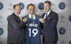 Minnesota Timberwolves owner Glen Taylor, left, new Wolves President of basketball operations Gersson Rosas, center, and Wolves CEO Ethan Casson, pose