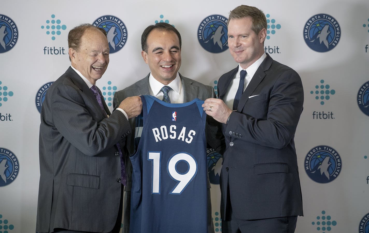 Minnesota Timberwolves owner Glen Taylor, left, new Wolves President of basketball operations Gersson Rosas, center, and Wolves CEO Ethan Casson, posed for photos after a press conference introducing Rosas at the Target Center, Monday, May 6, 2019.