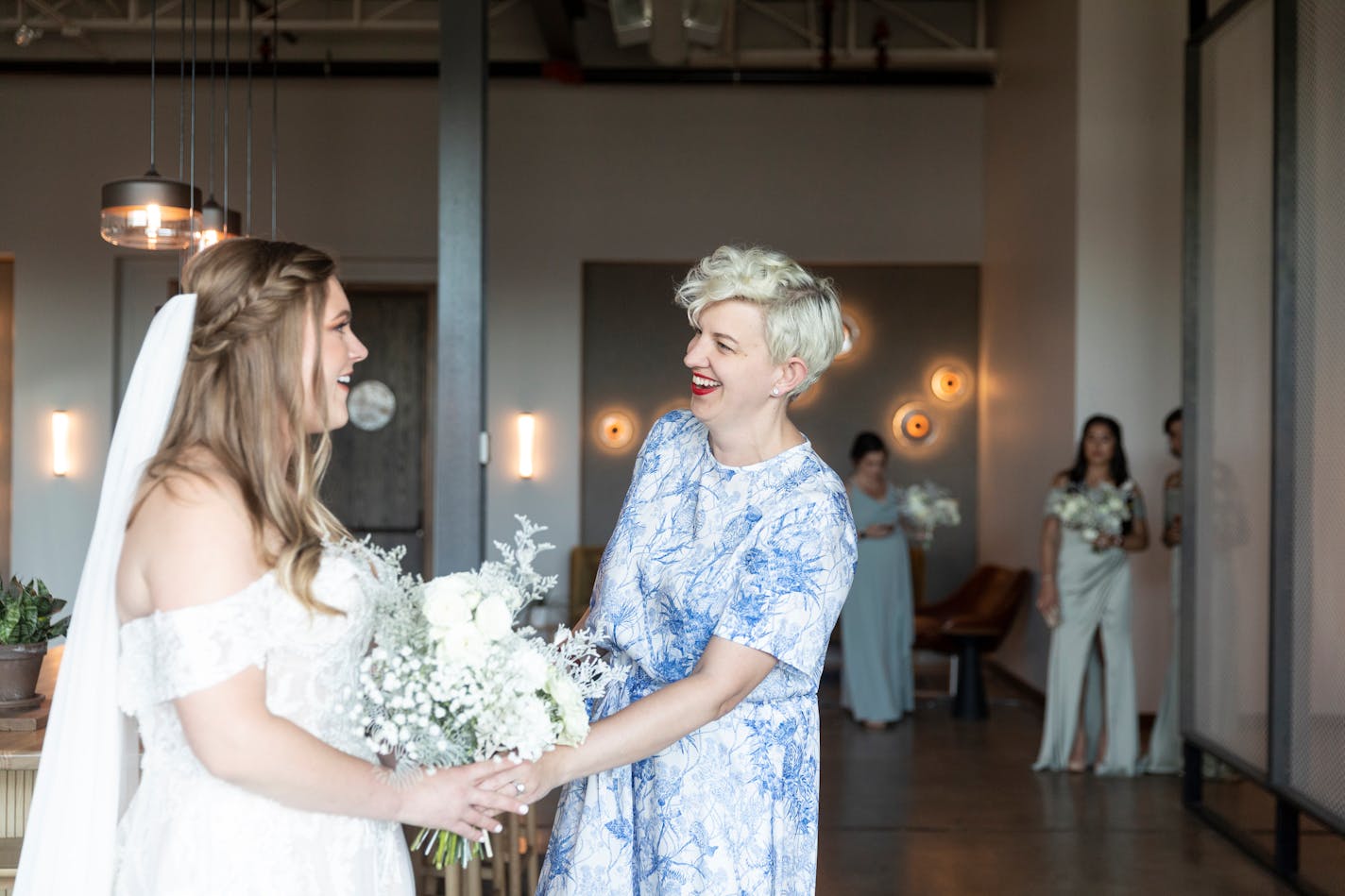 Gretchen Culver, right, the founder of Rocket Science Events and Minne Weddings, at the June 6, 2021, wedding for Catie Hawk, left, in Minneapolis. As nuptials were canceled across the country due to the coronavirus pandemic, wedding planners have downscaled — and in some cases their new offerings will stick. (Jenn Ackerman/The New York Times)