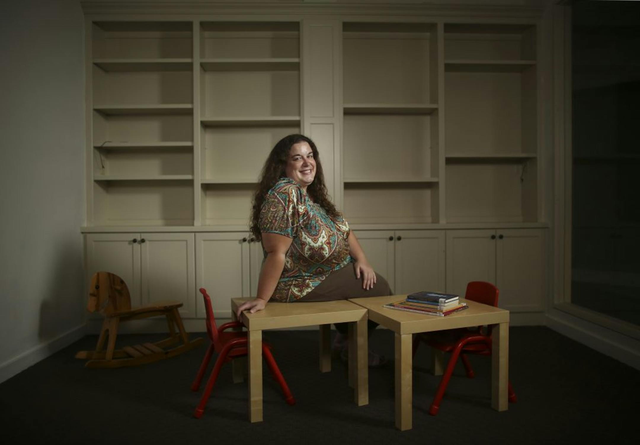 Lake Elmo withdrew from the Washington County system on Jan. 1 to start its own library. The city used the money it would have paid to the county system to buy a former car dealership and transform it into its new home. It's about ready to open, thanks to volunteers who have spent time painting walls and stocking shelves. Library Director Olivia Moris in what will clearly be the children's department of the soon-to-open Lake Elmo Public Library Monday evening, August 6, 2012. JEFF WHEELER • jeff