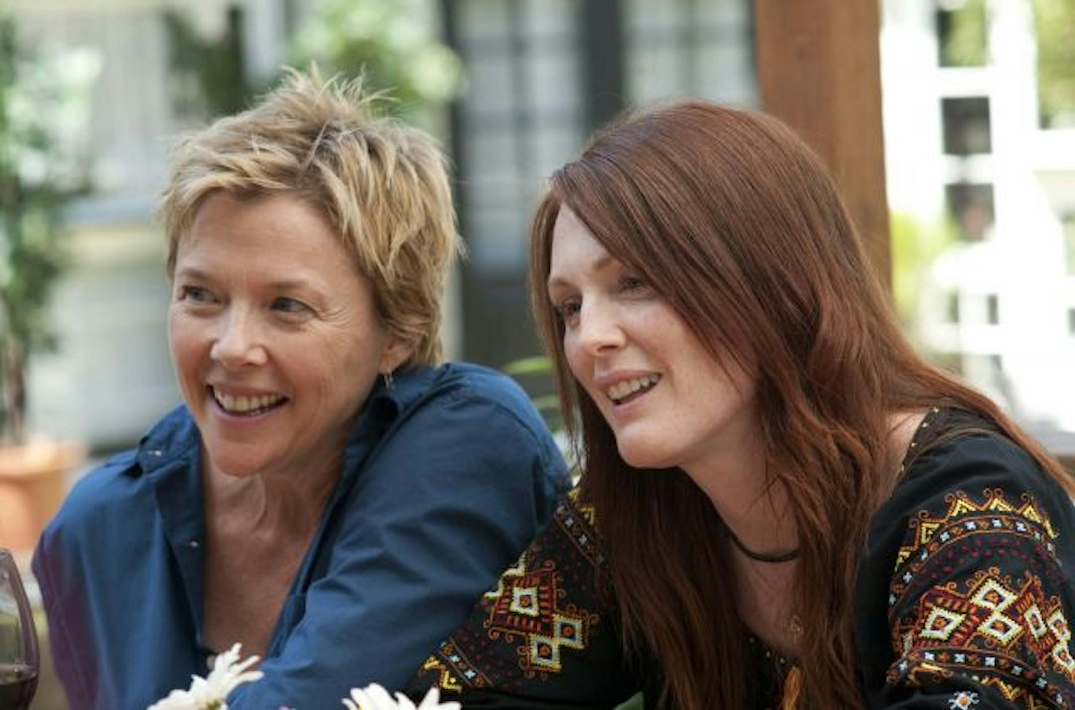 In this publicity image released by Focus Features, Annette Bening, left, and Julianne Moore are shown in a scene from "The Kids are All Right."