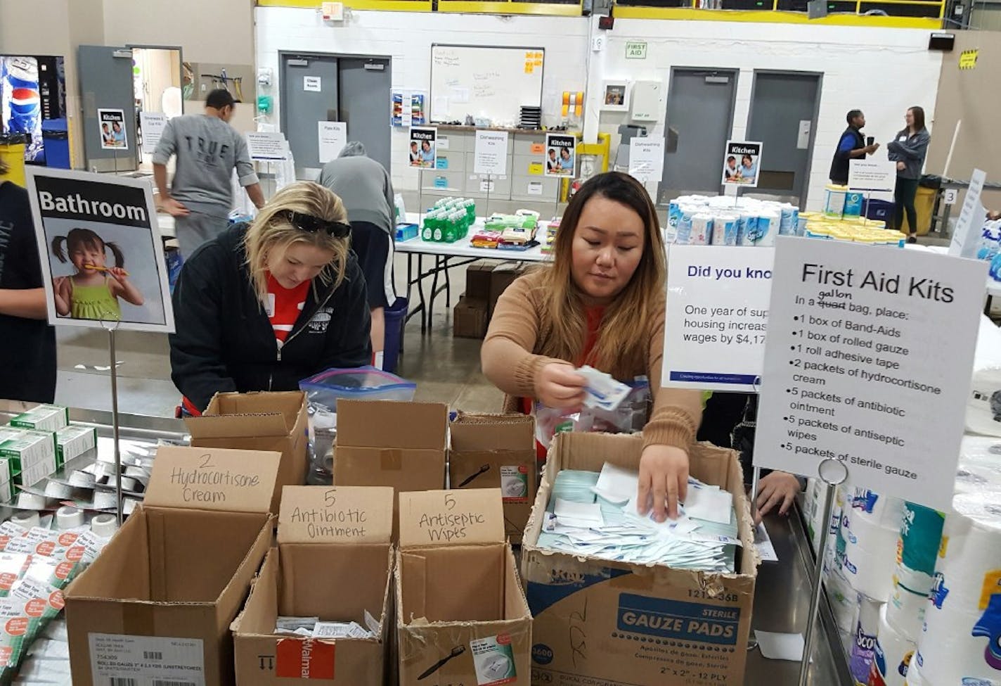 Ashley Bartyn (wearing sunglasses) and Debra Her help put together care packages for families escaping homlessness at a United Way "Home for Good" volunteer event in New Hope in November 2016.
Photo: Shannon Prather, Star Tribune