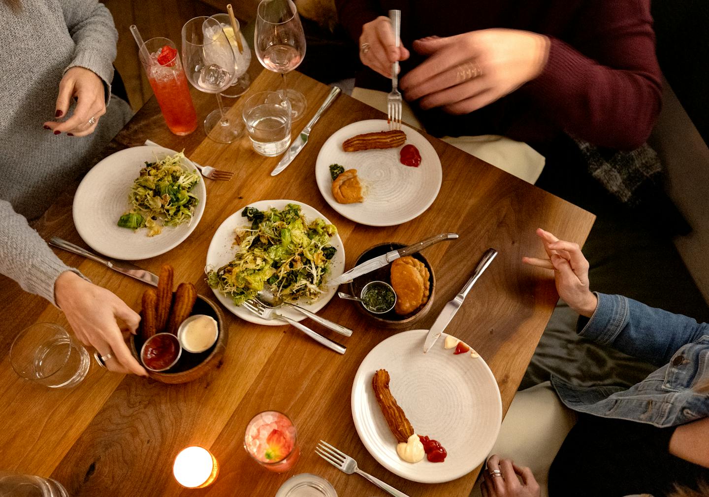 Alison Spencer, Julia Hutchinson and Celia Boren shared appetizers during their food club meeting Wednesday, December 20, 2023, at Martina in Minneapolis, Minn. ] CARLOS GONZALEZ • carlos.gonzalez@startribune.com