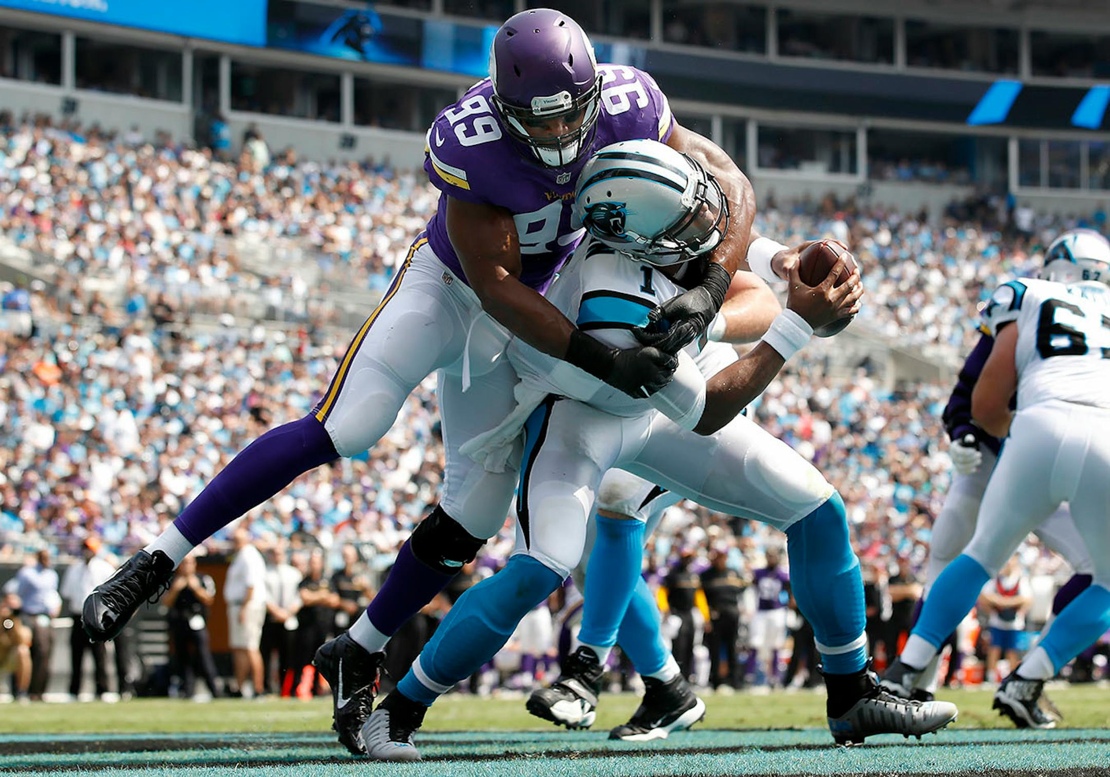Danielle Hunter (99) sacked Cam Newton (1) in the end zone for a safety in the first quarter.