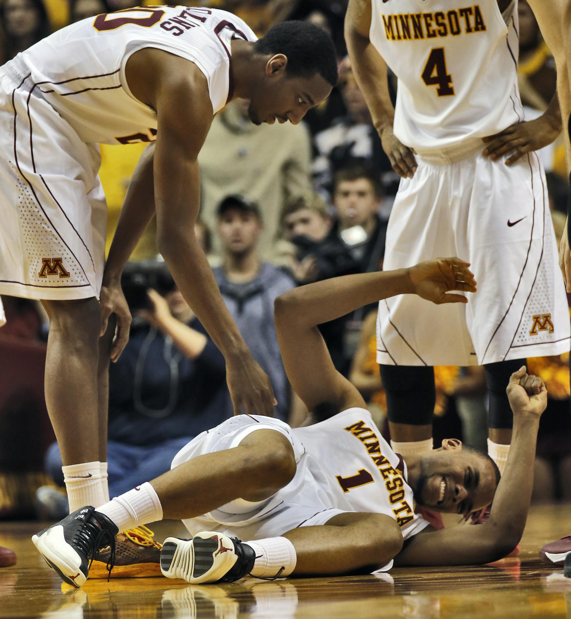 Minnesota Gophers vs. Wisconsin Badgers basketball. Minnesota guard Andre Hollins (1) went to the floor with an ankle injury in the opening moments of the game forcing him to head to the locker room. (MARLIN LEVISON/STARTRIBUNE(mlevison@startribune.com)