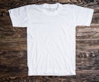 white cotton t-shirt on wooden background
istock