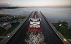 The Edwin H Gott passed under the Aerial Lift Bridge in Duluth in late August. (ALEX KORMANN/Star Tribune)