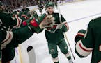 Minnesota Wild's Jason Zucker celebrates with teammates after scoring a goal in the second period against the Arizona Coyotes on Tuesday, Nov. 27, 201