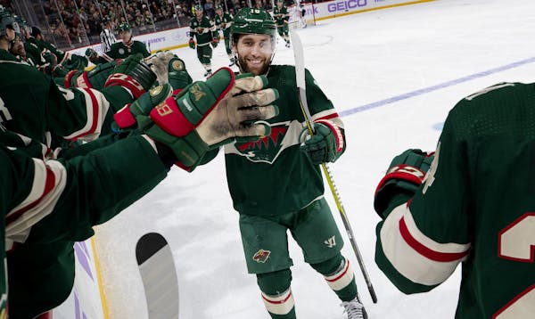 Minnesota Wild's Jason Zucker celebrates with teammates after scoring a goal in the second period against the Arizona Coyotes on Tuesday, Nov. 27, 201