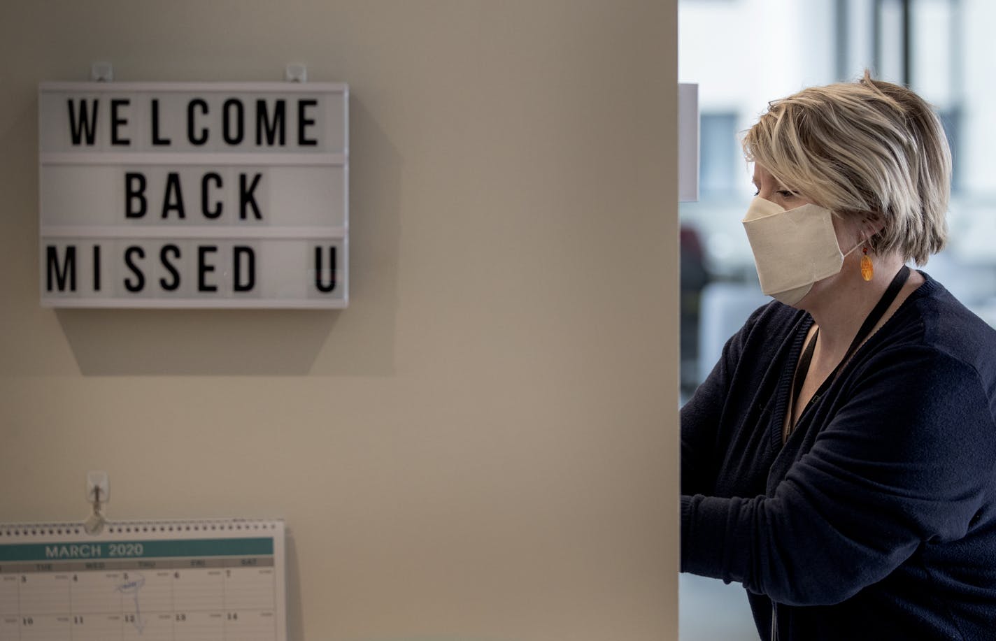 Rena Rasmussen, community manager at co-working office Wellworth, cleaned out coffee makers.