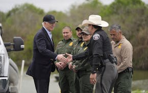President Joe Biden talks with the U.S. Border Patrol and local officials, as he looks over the southern border, Feb. 29, 2024, in Brownsville, Texas,