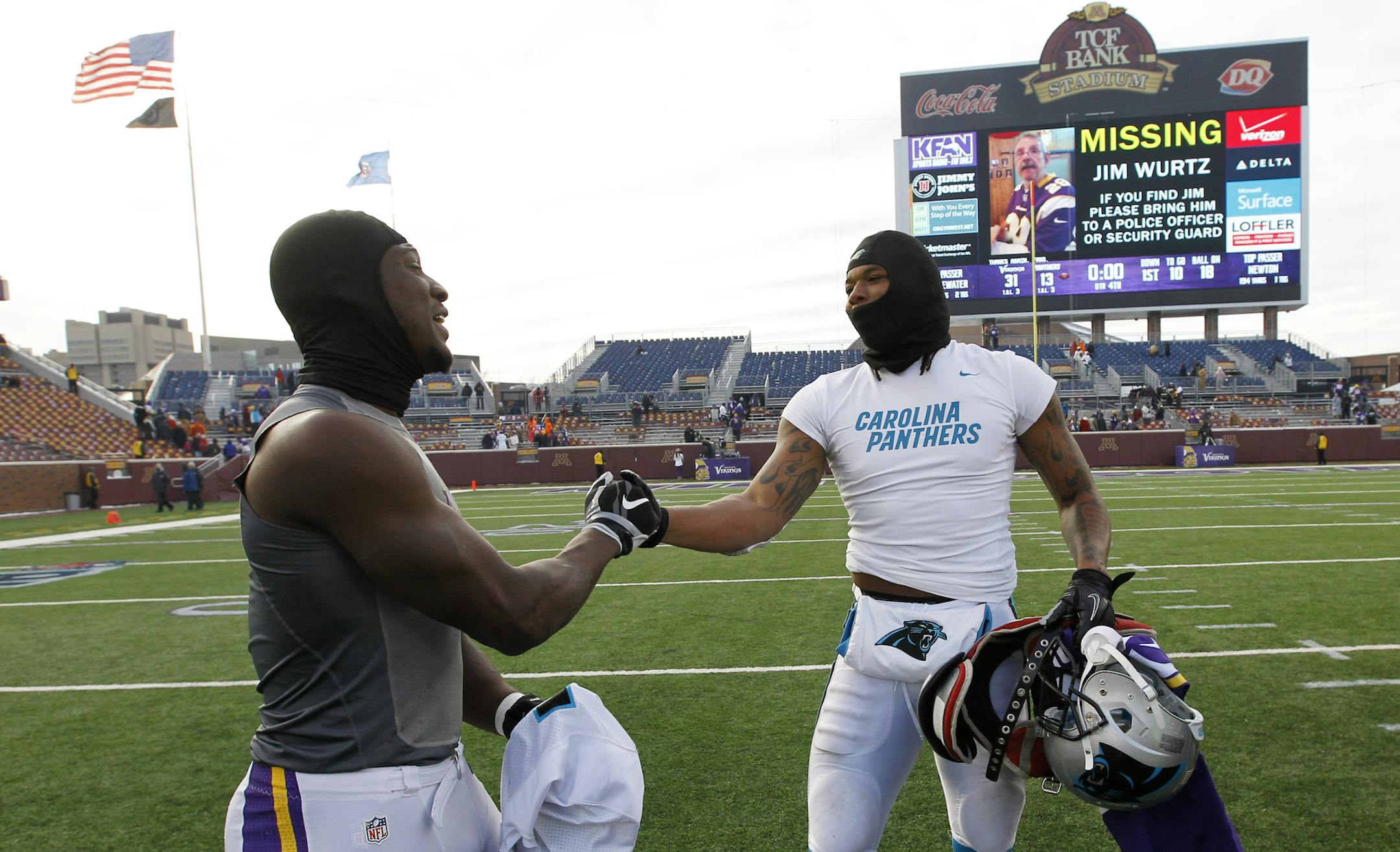 Minnesota Vikings cornerback Xavier Rhodes, left, exchanges jerseys with Carolina Panthers wide receiver Kelvin Benjamin, right, after an NFL football game, Sunday, Nov. 30, 2014, in Minneapolis. The Vikings won 31-13. (AP Photo/Ann Heisenfelt)