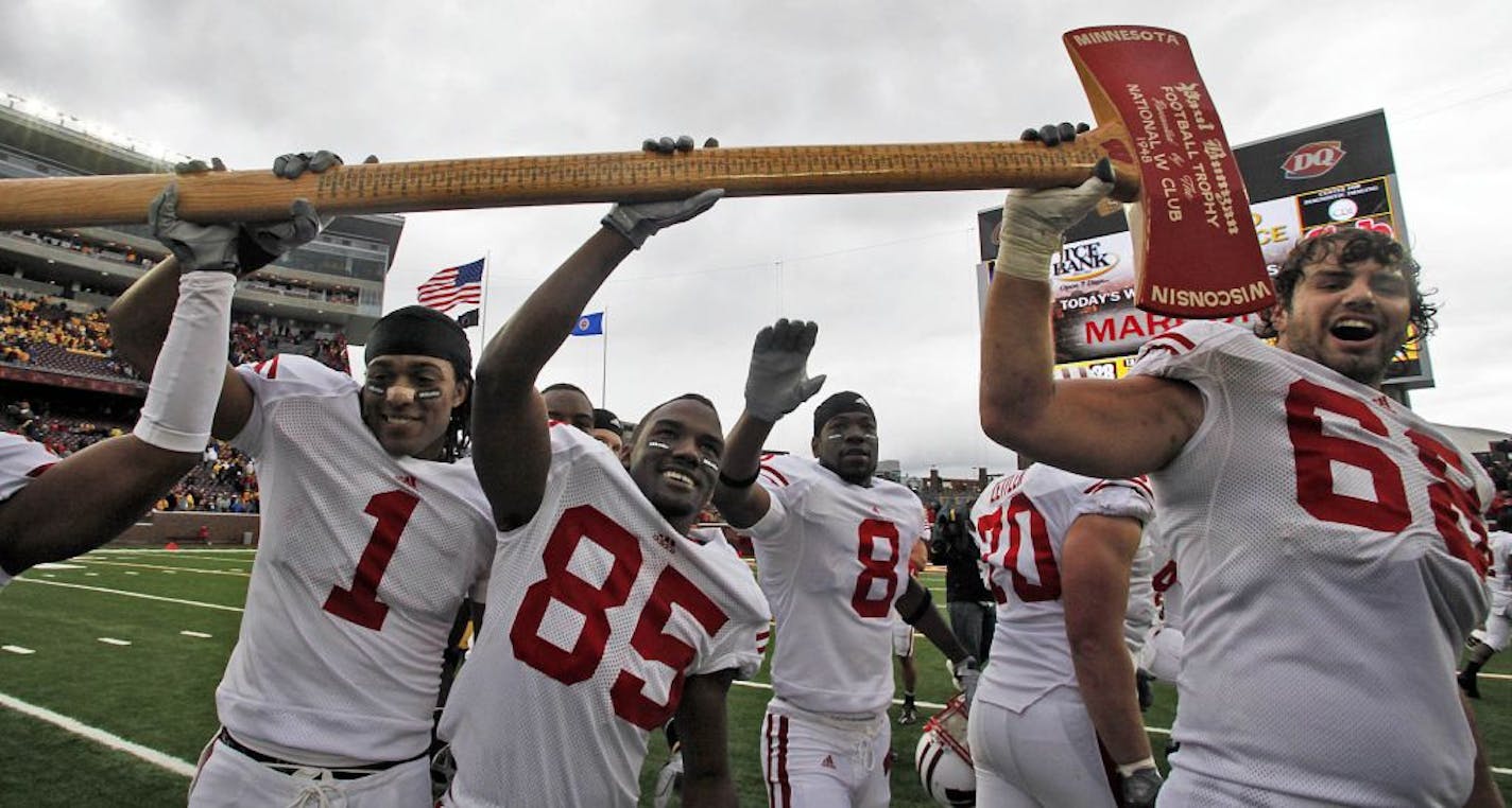 Wisconsin players celebrated at the end of the game by reclaiming Paul Bunyan's axe.