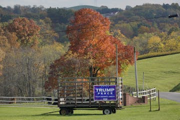 A Trump/Pence sign on a hay wagon in Freeport, Pa., on Oct. 15. U.S. farmers have received a record $40 billion in aid in 2020 from the federal govern