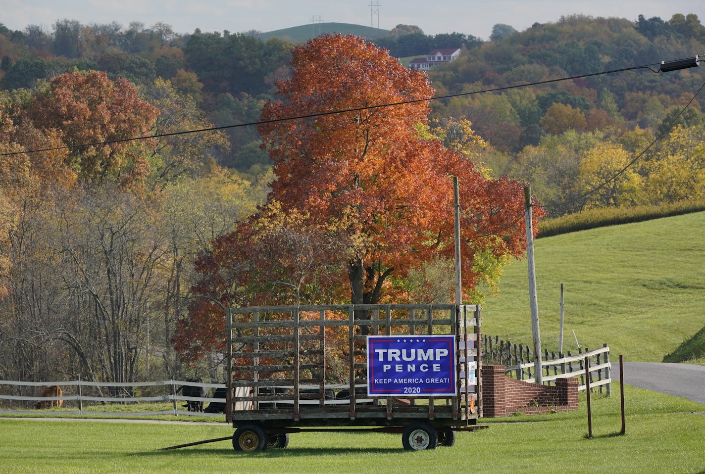 A Trump/Pence sign on a hay wagon in Freeport, Pa., on Oct. 15. U.S. farmers have received a record $40 billion in aid in 2020 from the federal government.